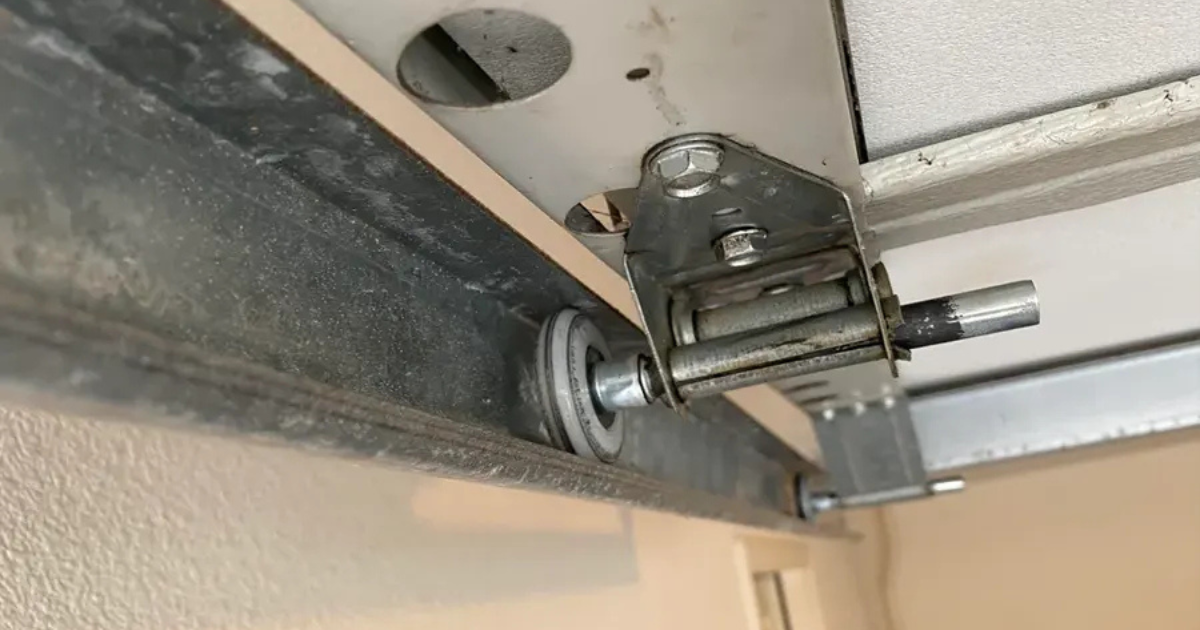 how to get a garage door wheel back on track