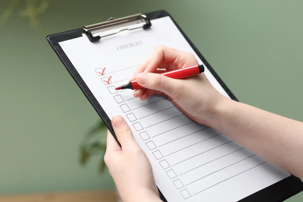 person filling checklist